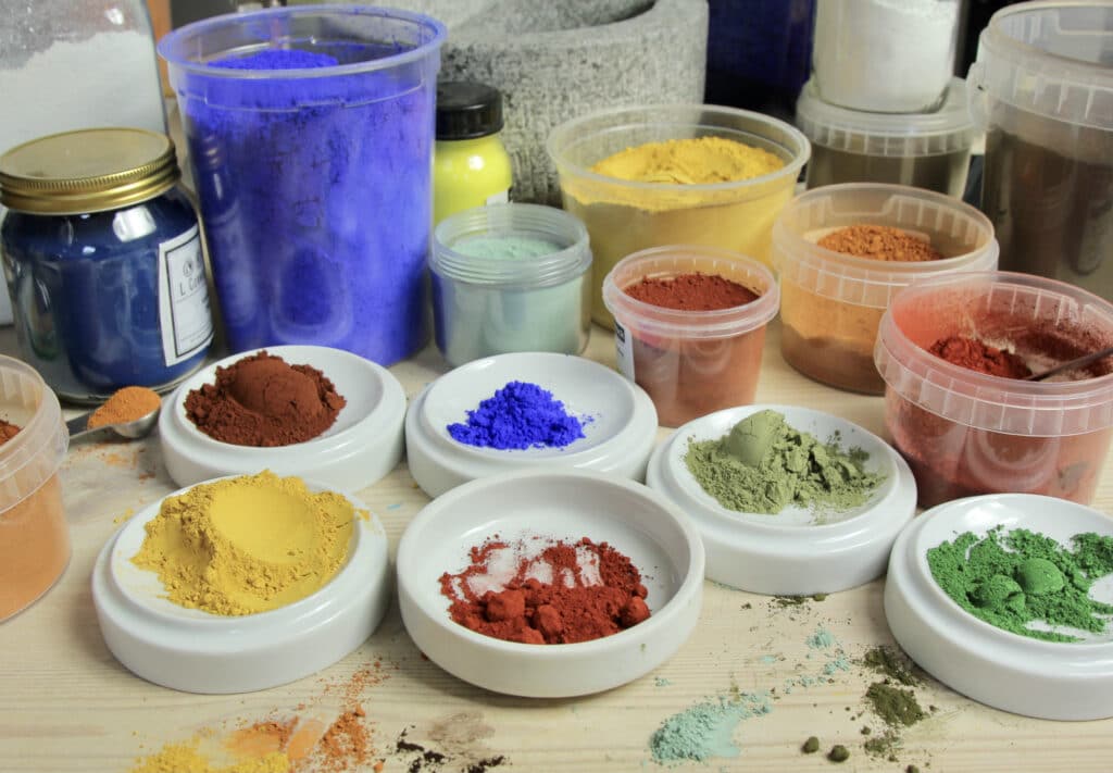 Earth and synthetic pigments on a table