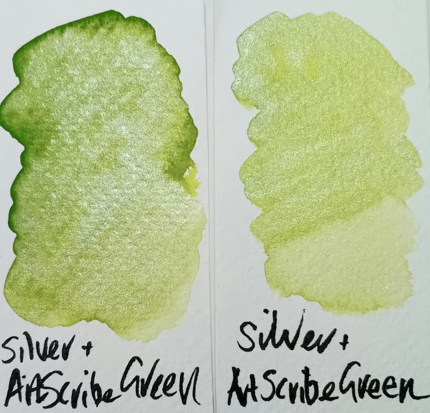 Two painted swatches alongside each other. One shows the Art Scribe Green popping through the silver shimmer. The other swatch shows a more evenly distributed mix of the and the silver.